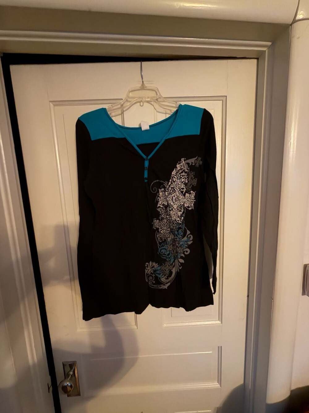 Liberty Wear Women's Black and Teal Long Sleeve Graphic Henley Top with Embellis